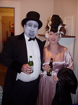 frankenstien in a top hat and his bride