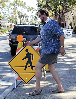 Jim imitating a yellow cross walk sign