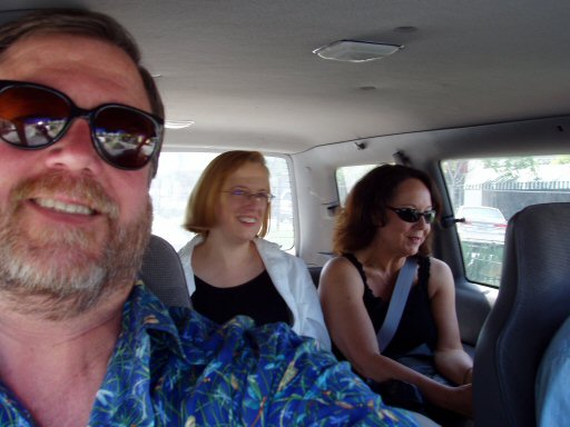man and two women in a car